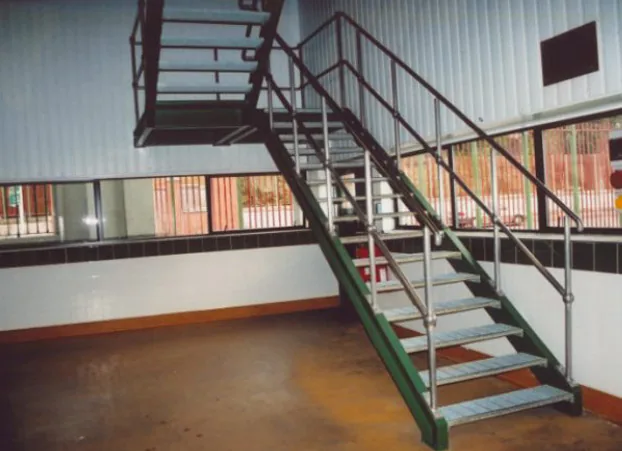 Steel stairs with grating treads and handrails